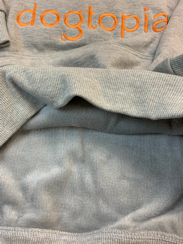 Inside view of Soft light gray hoodie with Dogtopia in orange